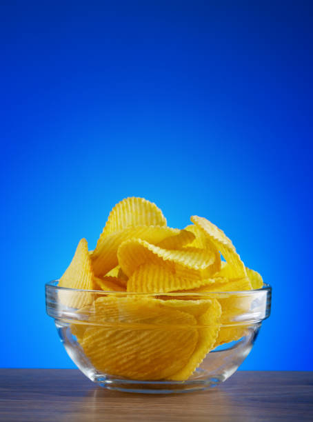 istock Round transparent plate with potato chips 1262397423