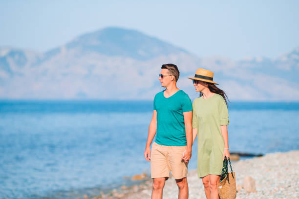 istock Young couple on white beach during summer vacation. 1262397434