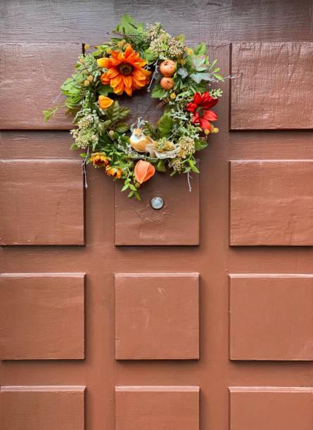 istock Brown door with thanksgiving wreath 1262401852