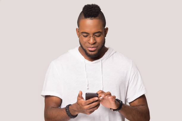 istock African American man stand using smartphone in studio 1262402129