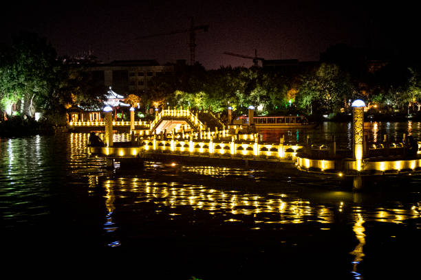 istock Exotic bridge illuminated in gold light at night 1262406104