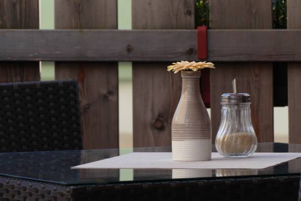 istock Garden table with vase and sugar 1262406108
