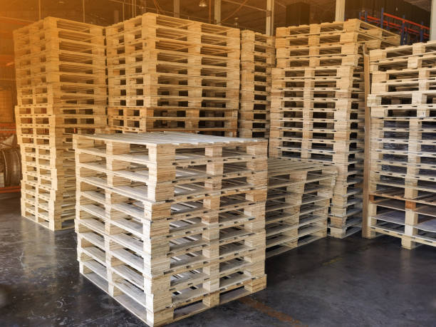 istock Wooden pallets stack at the freight cargo warehouse for transportation and logistics industrial 1262406161
