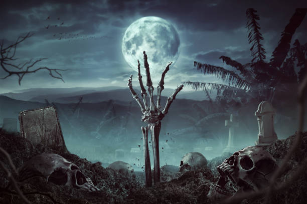 istock Zombie skeleton hand rising in dark Halloween night. 1262406227