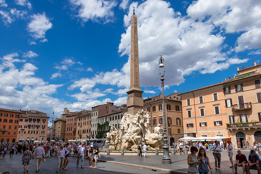 Tourists at Piazza Navona in front of Santa Agnese church in Rome