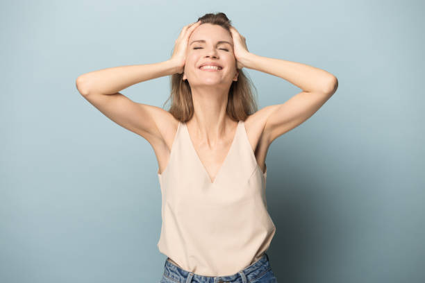 istock Happy young woman feel happiness posing in studio 1262412362
