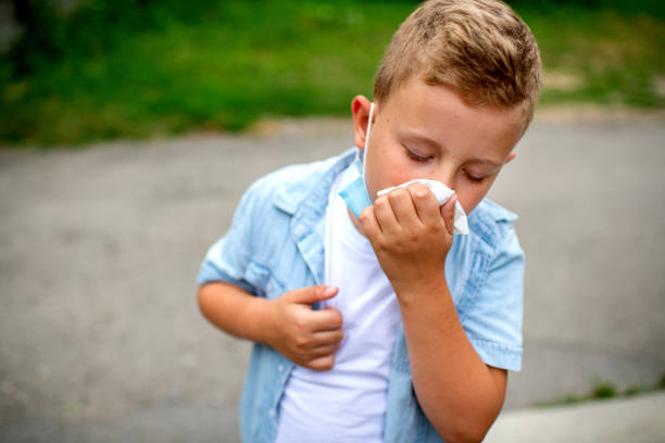 istock Little blond boy sneezing 1262412634
