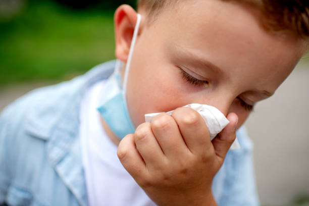 istock Little blond boy sneezing 1262412724
