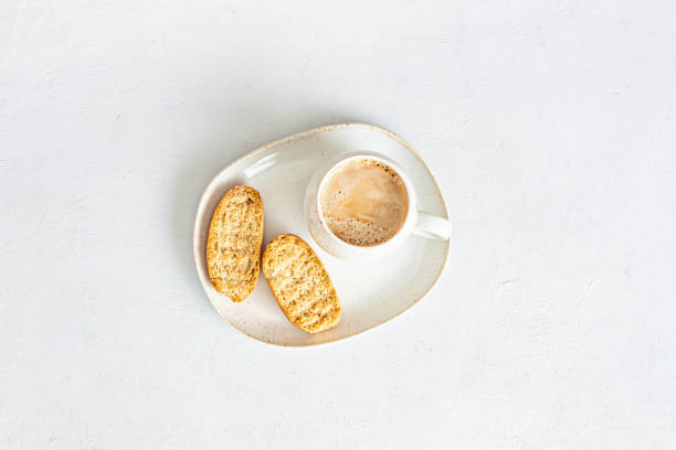 istock Styled minimal desktop mockup with coffee cup and crackers. Breakfast, Freelancer, social media blogger concept. Flat lay, top view 1262413998