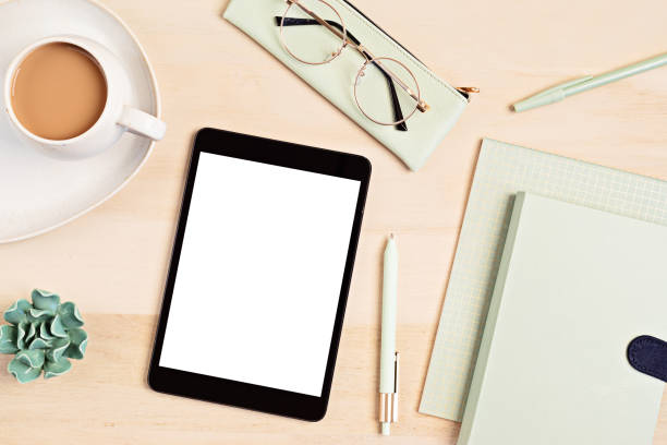 istock Styled minimal desktop mockup with organic color stationary, coffee cup, notepad. Freelancer, social media blogger concept. Flat lay, top view, copy space. 1262414017