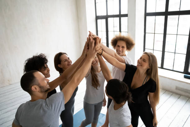 istock Young multiracial people in activewear giving high five after training. 1262414141