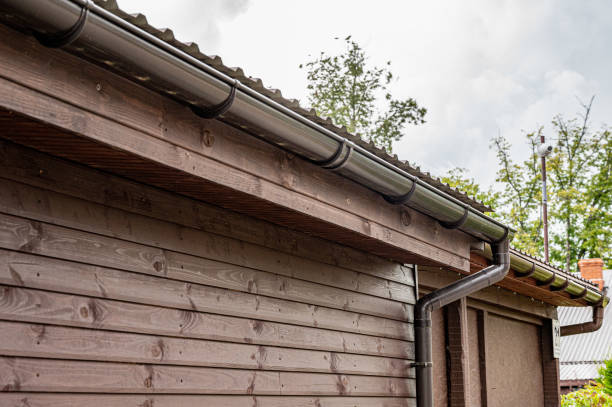 istock Roof edge of a small house with installed rainwater drainage system.  rain gutter system. 1262416653
