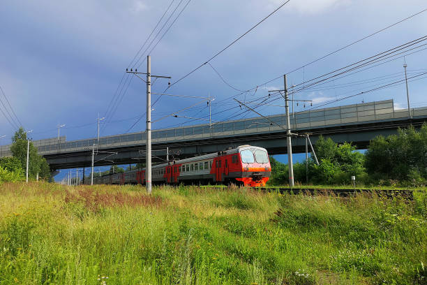istock train at the railway in a rural landscape. Evening, summer time 1262420153
