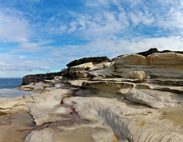 istock Beautiful coalstal trail with stunning rock formations and cliffs along the ocean front in the national park 1262423123