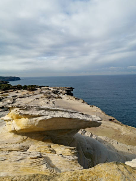 istock Beautiful coalstal trail with stunning rock formations and cliffs along the ocean front in the national park 1262423197