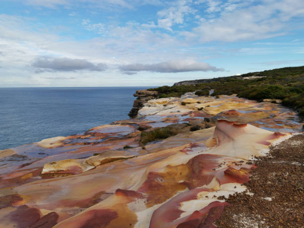 istock Beautiful coalstal trail with stunning rock formations and cliffs along the ocean front in the national park 1262423256