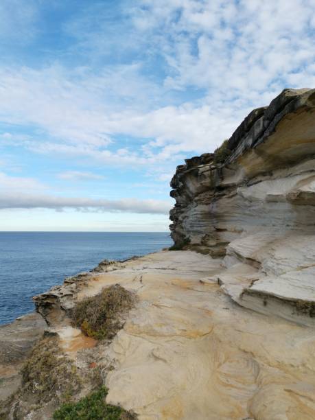 istock Beautiful coalstal trail with stunning rock formations and cliffs along the ocean front in the national park 1262423337