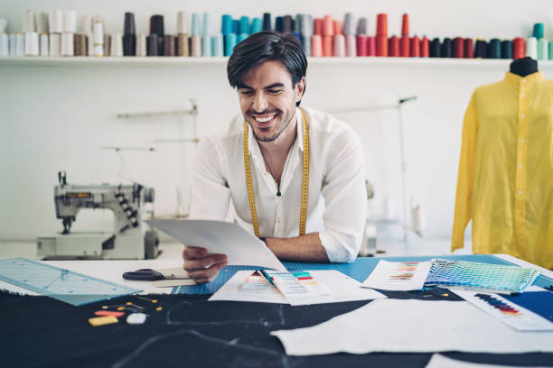 istock Designer looking through color swatches 1262424847