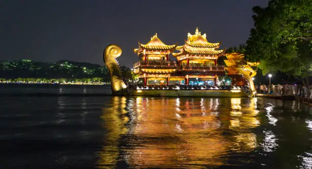 Photo of Illuminated dragon boat on the West lake in Hangzhou, China