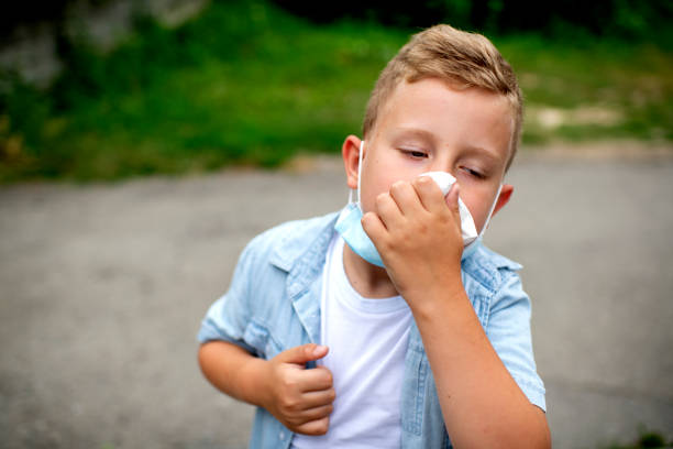 istock Little blond boy sneezing 1262434918
