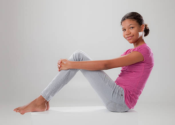 istock Young girl poses on high key set. 126244119