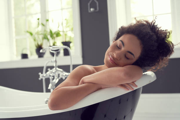 istock Calm young woman relaxing in hot bath 1262451366