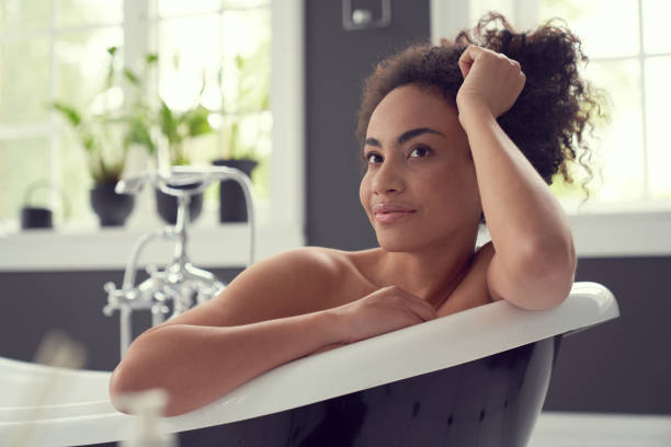 istock Joyful pretty woman spending morning in bathroom 1262451439