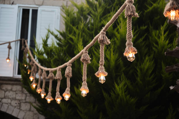 istock Decorative garden lighting design made with bulbs and thick rope 1262451565