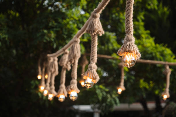 istock Decorative garden lighting design made with bulbs and thick rope 1262452116