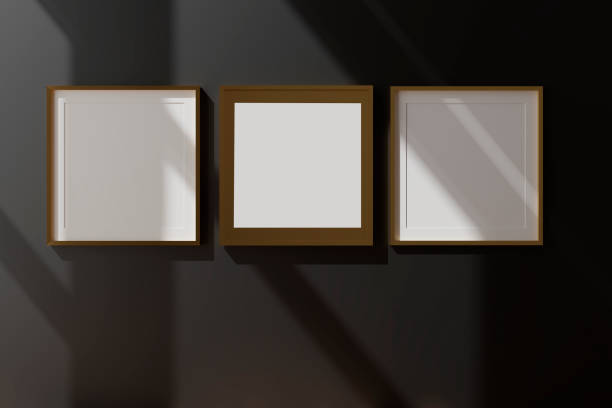 istock Three vertical white frame mockup, golden frame on black wall, 3d illustration 1262478640
