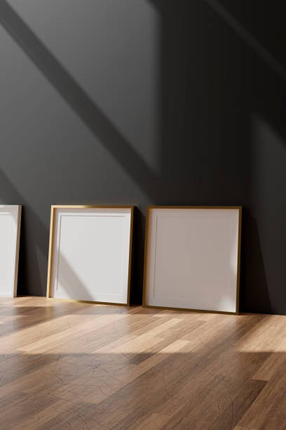 istock Three vertical white frame mockup, golden frame on black wall, 3d illustration 1262478652