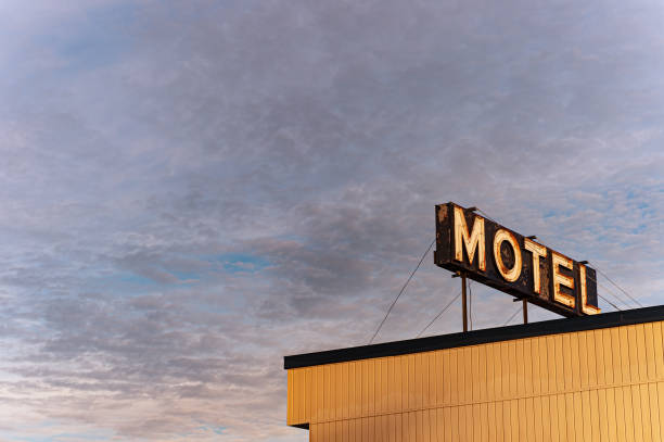 istock Motel neon sign over a cloudy sky 1262482275