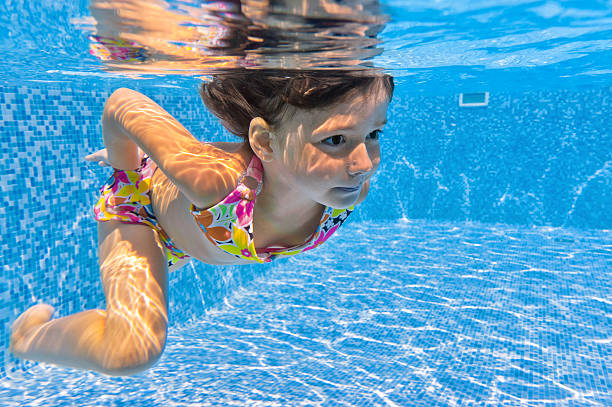 istock Happy smiling underwater kid in swimming pool 126248489