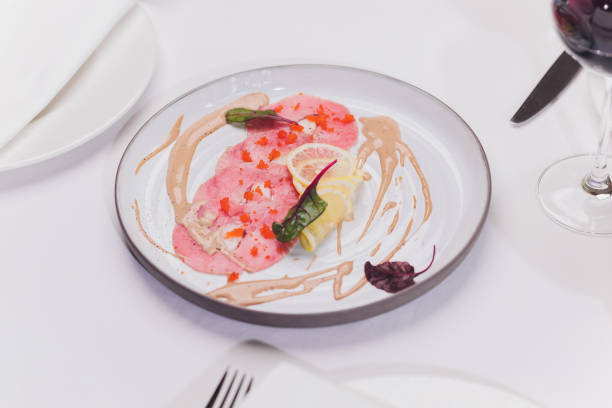 istock Smoked salmon and ingredients in plate on table. 1262489126