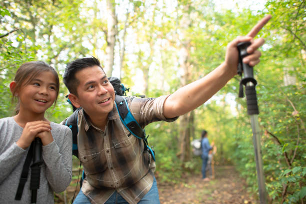 istock Family hiking through the forest 1262490370