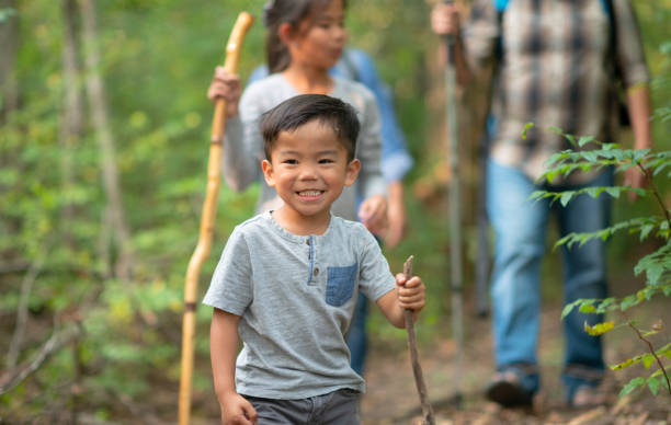 istock Family hiking through the forest 1262490383