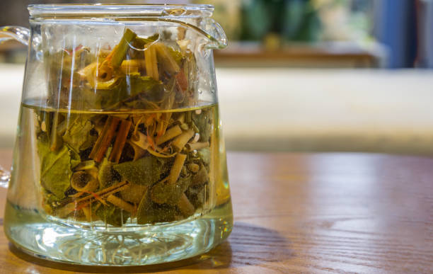 istock Fresh organic herbal tea in teapot in the room background. 1262490475