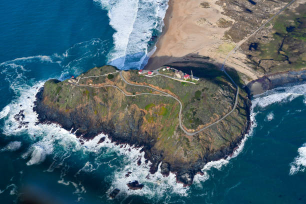 istock Aerial beach mountain coastline lighthouse 1262491084