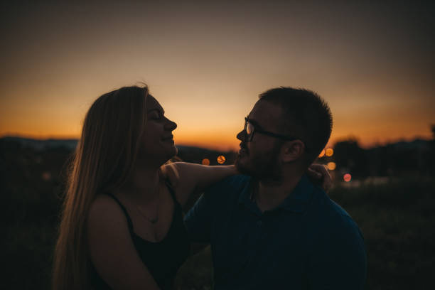 istock Sunset couple silhouette 1262491138