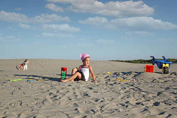 istock children playing in the sand 126249351