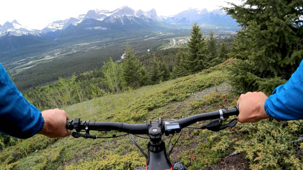istock Mountain e-biker rides along mountain ridge 1262499750