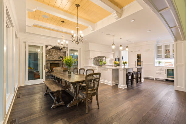 istock Dining area with yellow wood paneled ceiling and white beams 1262508664
