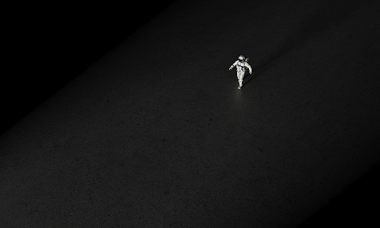 Astronaut walking in direction of the light