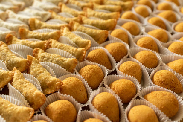 istock Brazilian gastronomy. Various snacks, such as pastries, chicken drumsticks and risoles. 1262540753