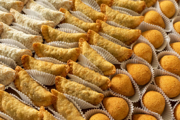 istock Brazilian gastronomy. Various snacks, such as pastries, chicken drumsticks and risoles. 1262540756