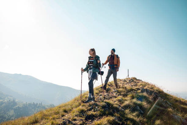 istock Young couple hiking in the mountains 1262542763