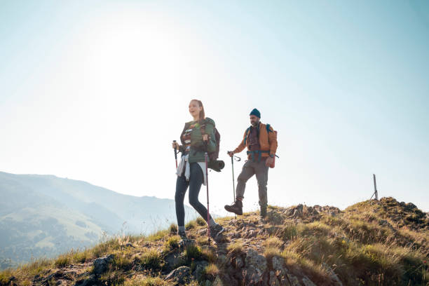 istock Young couple hiking in the mountains 1262543994