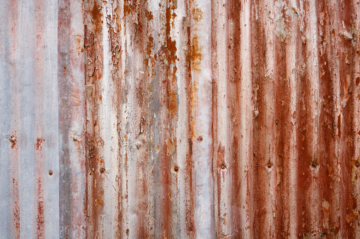 Rusted corrugated iron fence