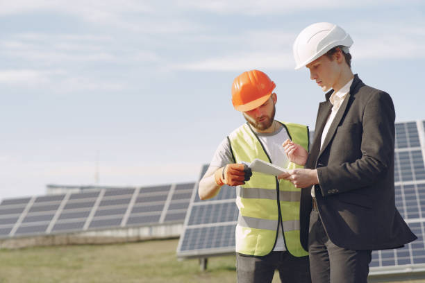 istock Foreman and businessman at solar energy station 1262561495