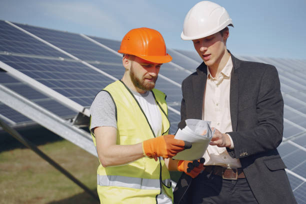 istock Foreman and businessman at solar energy station 1262562012